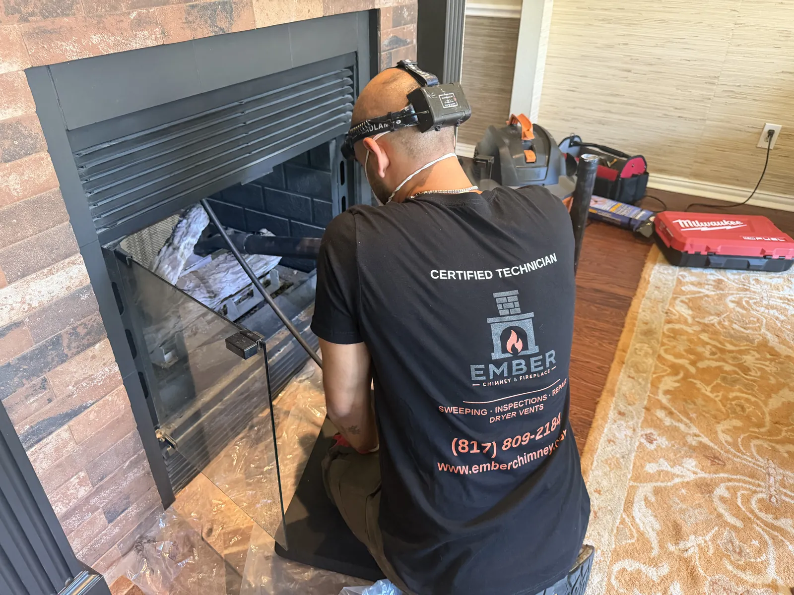 Ember technician vacuuming a fireplace flue