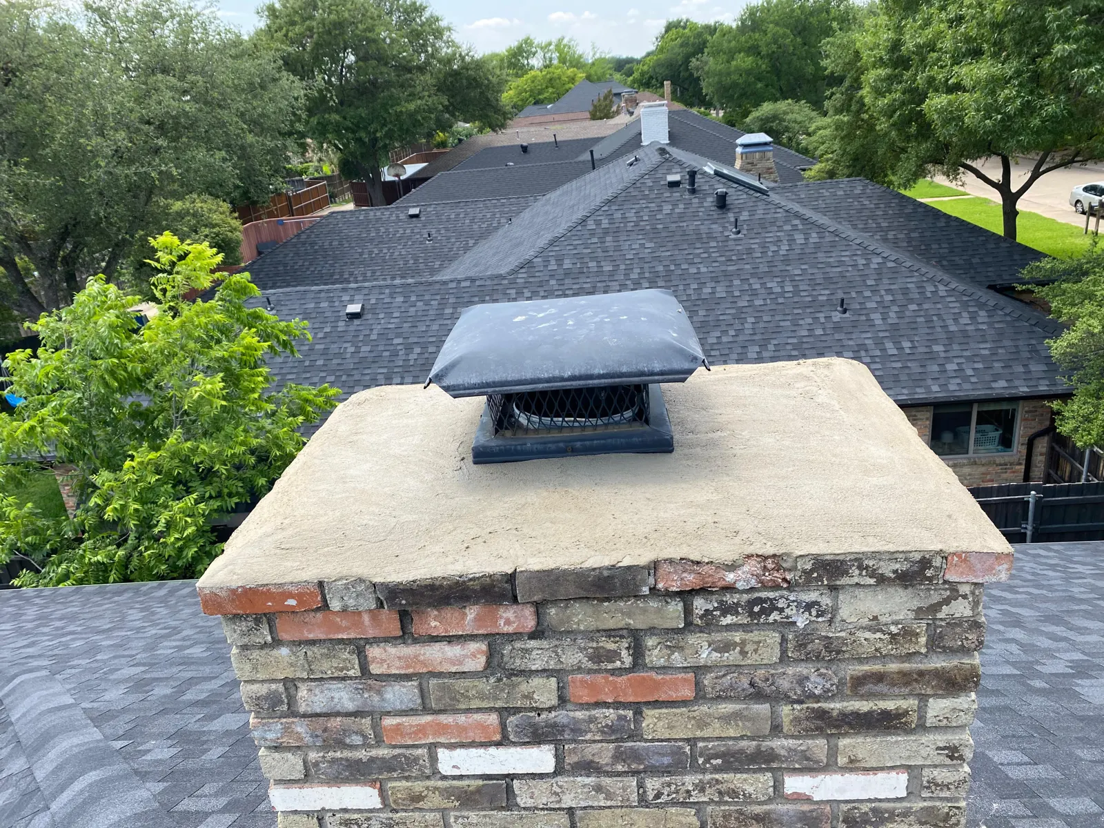 Chimney cap on a brick chimney