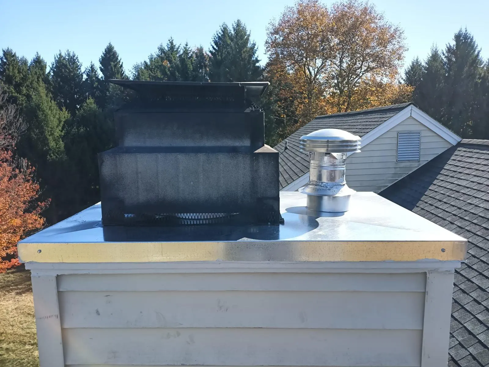 Metal chimney cap on a crown