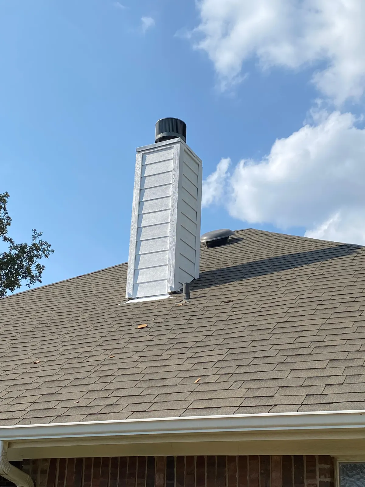 Metal chimney with a cap