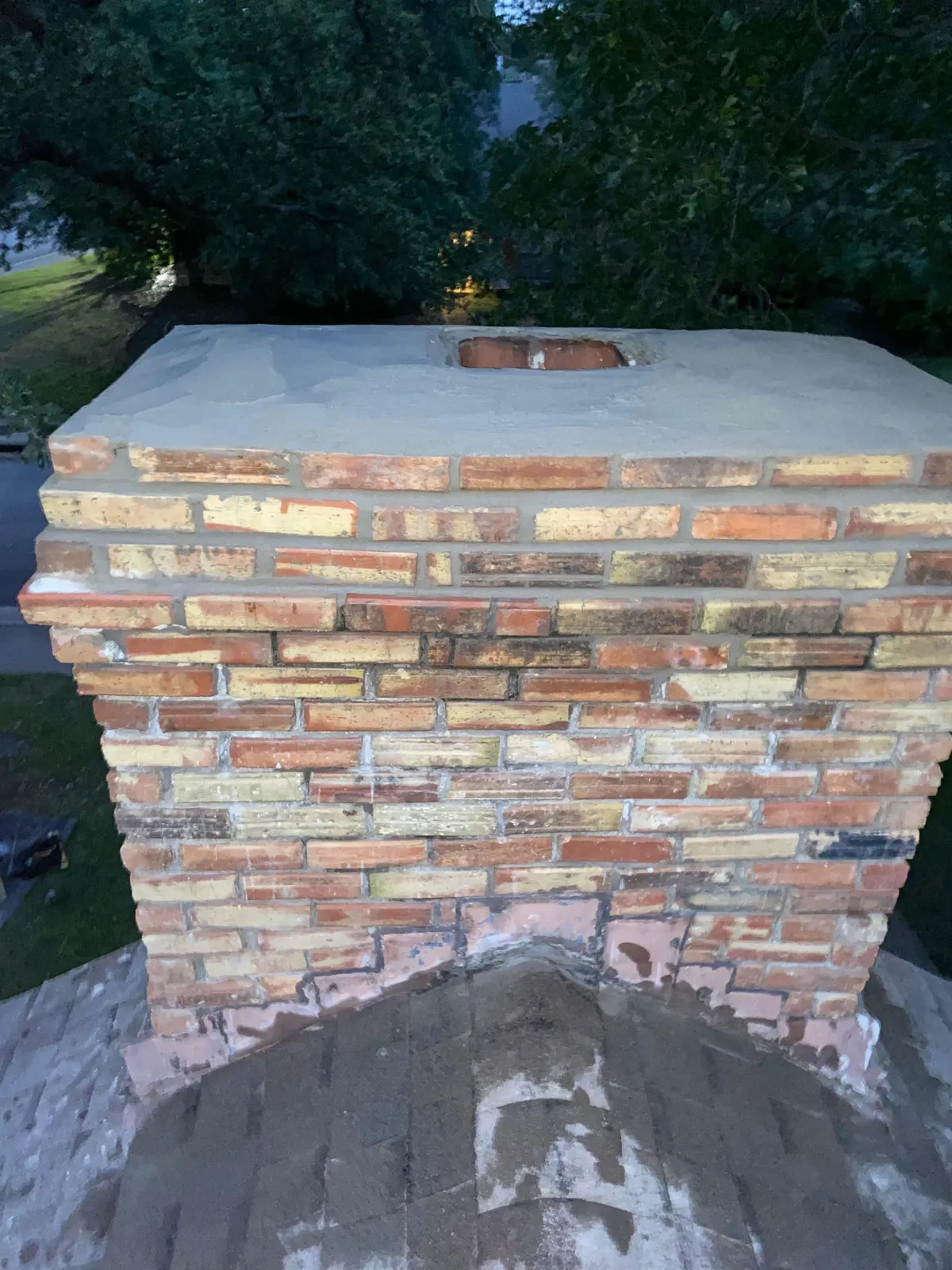 Worn brick chimney with no cap