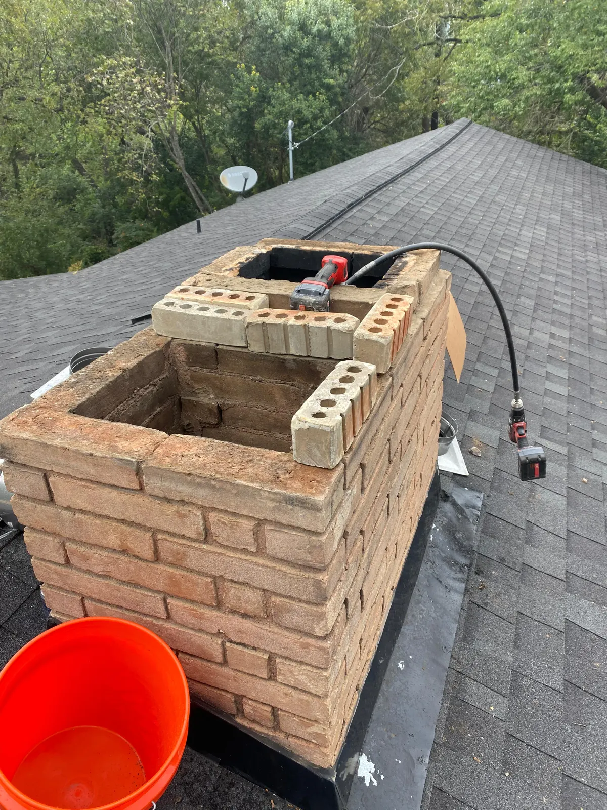 Brick chimney opened for masonry repair